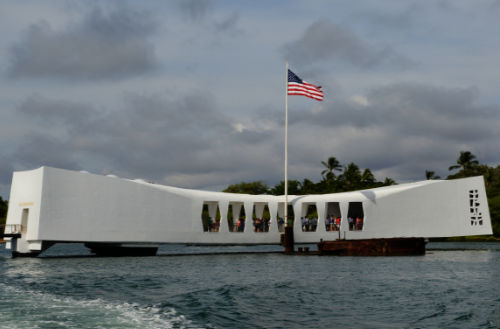 Tourists gather inside the USS Arizona Memorial, one of many stops offered our private Pearl Harbor tours.