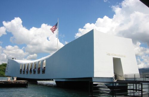 A private Pearl Harbor tour is guided through the solemn USS Arizona Memorial.