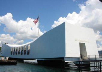 A private Pearl Harbor tour is guided through the solemn USS Arizona Memorial.